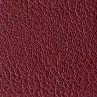 Burgundy pebble-grain leather texture with subtle tonal variations, matte finish, and dense weave; manufacturer text reads "verzelloni > leather."